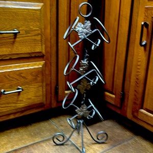 Grey 6 bottle wine rack. Sits on floor or could hang from something sturdy
